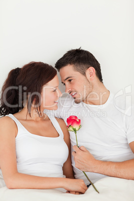 Happy couple with a rose