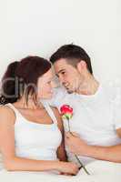 Happy couple with a rose