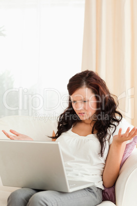 Confused woman with a laptop