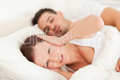 Woman not wanting to hear snoring