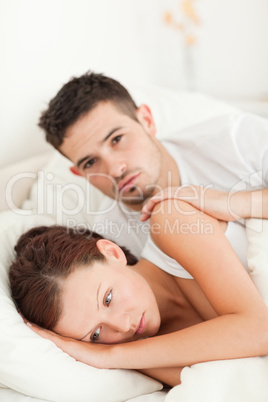 Sad woman comforted by her husband