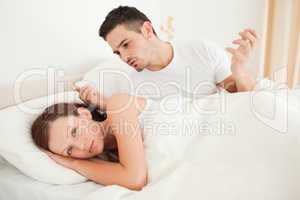 Unhappy couple in a bed