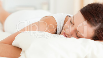 Woman sleeping in her bed