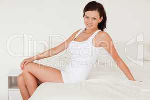 Woman posing on her bed