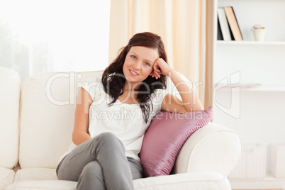Portrait of a posing woman on a sofa