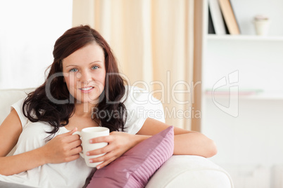 Portrait of a woman holding a cup