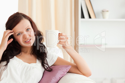 Woman holding a cup of coffee