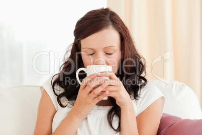 Portrait of a gorgeous woman drinking coffee