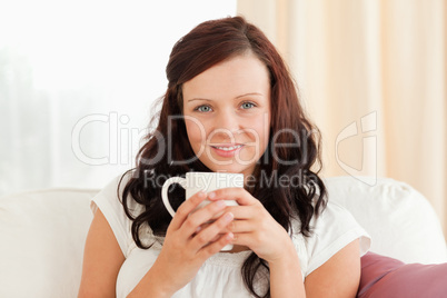 Cute woman holding a cup