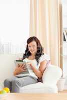 Charming woman holding a tablet