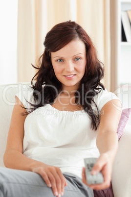 Portrait of a gorgeous woman watching TV