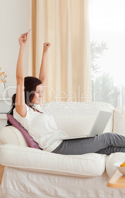 Cheerful woman with a laptop