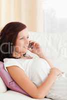 Close up of a woman sitting on a sofa