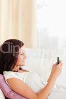 Lovely woman texting with mobile phone