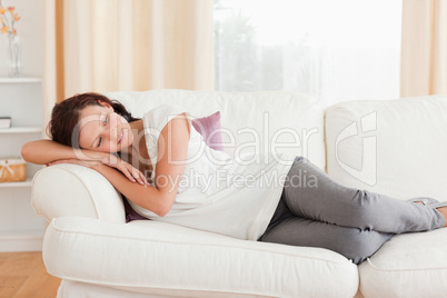 Relaxing woman lying on the sofa