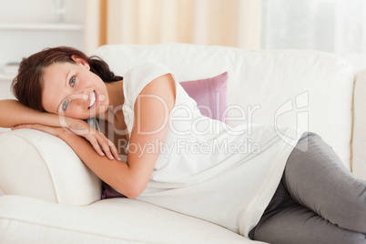 Cute woman relaxing on her sofa