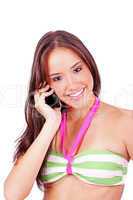 young smiling woman talking by phone on a white background