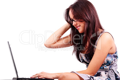 Pretty woman with confused expression working on laptop