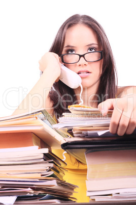 Stressed young businesswoman with telephone in her hand.