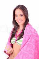 girl with a pink towel on the beach