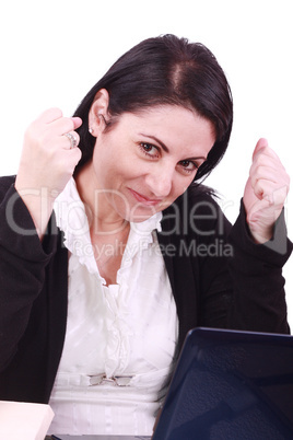 Business woman happy in front of her laptop at the office