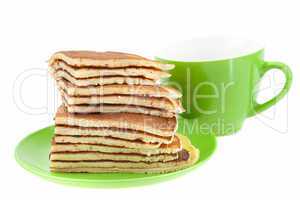 Pancakes on a plate and cup isolated on white