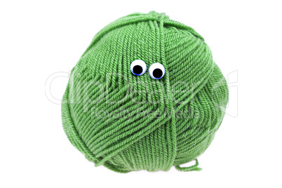 skein of wool  with eyes isolated on white