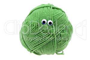 skein of wool  with eyes isolated on white