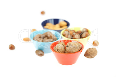 nuts in bowls isolated on white