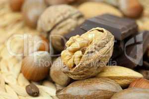 bar of chocolate and nuts on a wicker mat