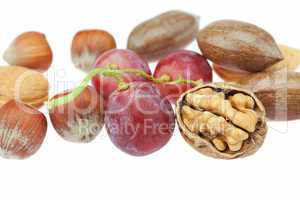nuts and grapes isolated on white
