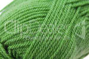 Skein of wool and knitted piece  background