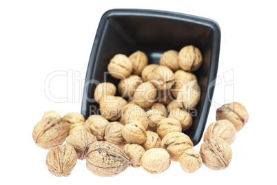 walnuts in a bowl isolated on white