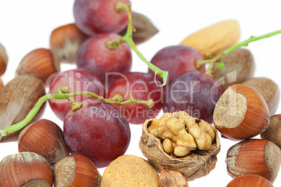 nuts and grapes isolated on white