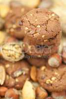 oatmeal cookies, chocolate and nuts on a wicker mat