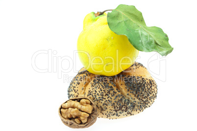 loaf with poppy seeds, quince and walnut isolated on white