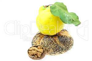 loaf with poppy seeds, quince and walnut isolated on white