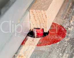 Macro shot of router bit cutting into wood