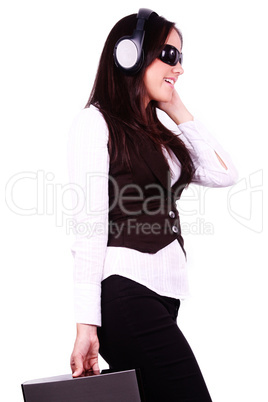 Beautiful woman listening to music on her headphones Beautiful woman listening to music on her headphones
