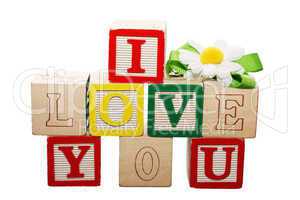 Phrase I LOVE YOU formed from wooden letter blocks