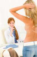 Plastic surgery female doctor look patient breast