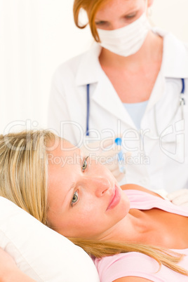 Medical doctor apply injection to woman patient