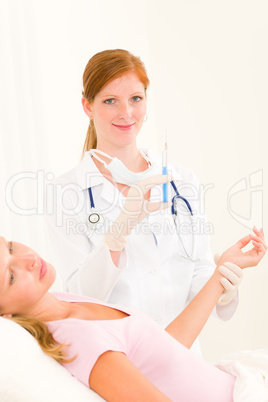 Medical doctor apply injection to woman patient