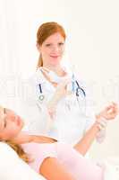 Medical doctor apply injection to woman patient