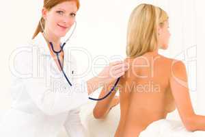 Medical doctor stethoscope examine woman patient