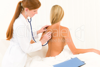 Medical doctor stethoscope examine woman patient