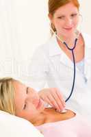 Medical doctor stethoscope examine woman patient