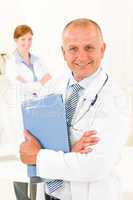 Medical doctor team senior male hold folders