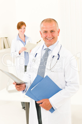 Medical doctor team smiling male hold x-ray