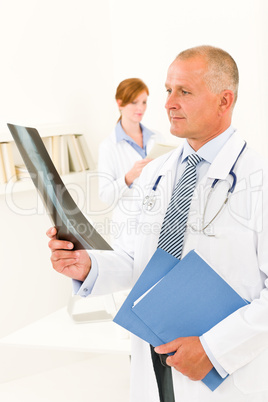 Medical doctor team male look at x-ray